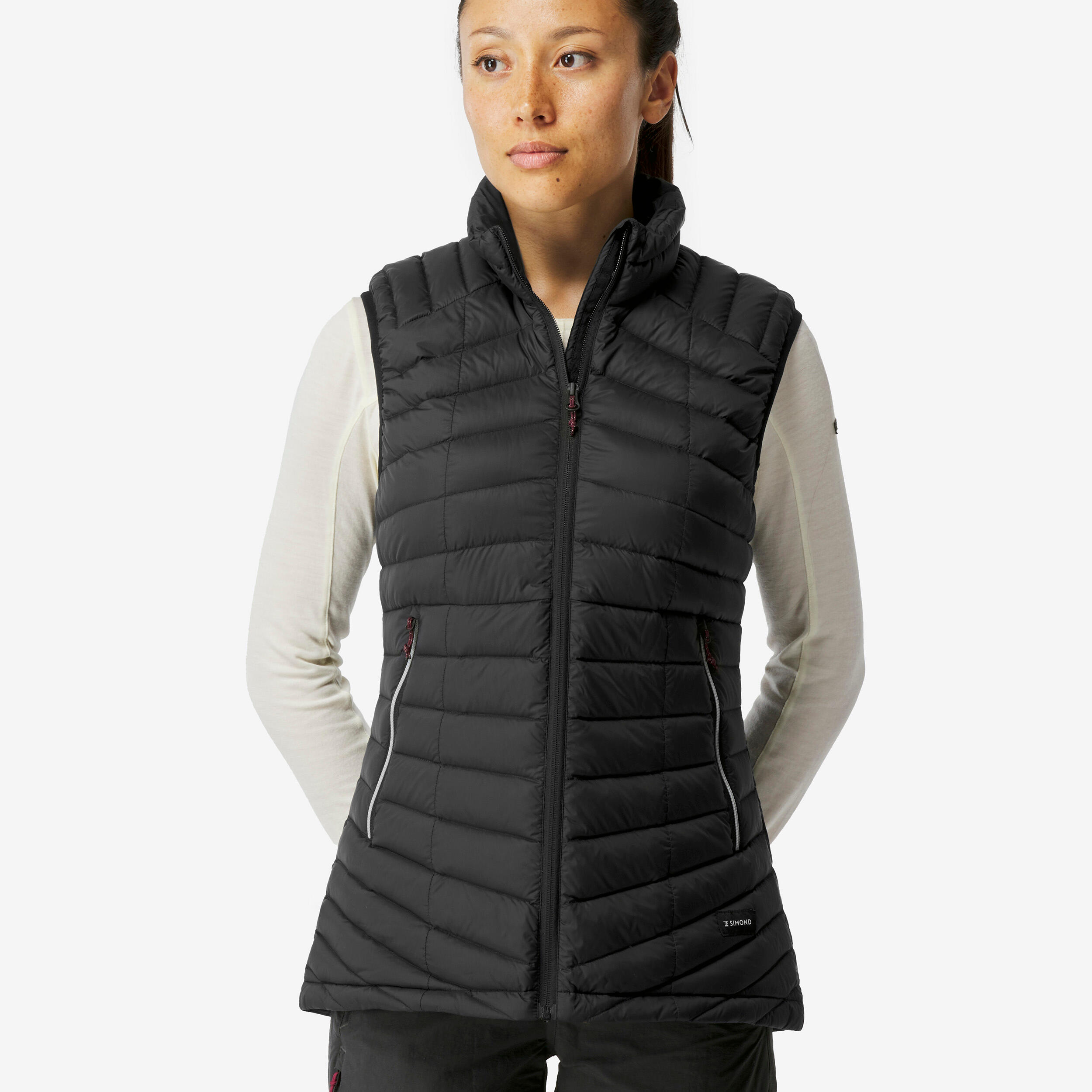 chalecos-plumas-mujer-097gwt-1.jpg Chaleco acolchado de montaña y trekking plumón Mujer Forclaz MT100 - Imagen 1